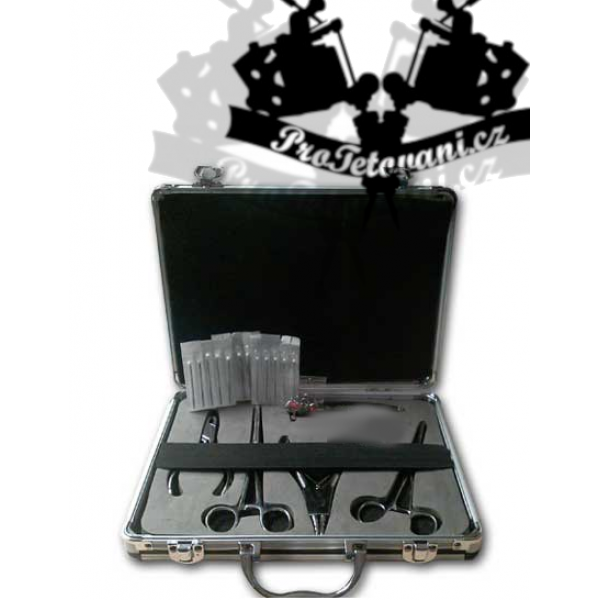Piercing set with pliers in a briefcase